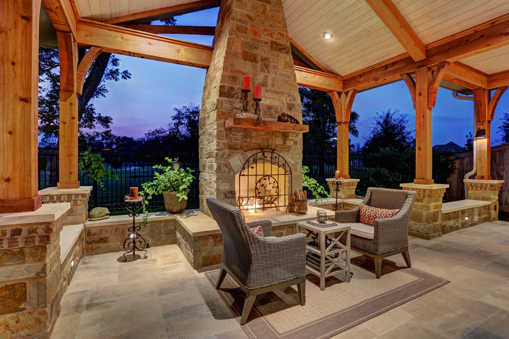 Huge mountain style backyard tile patio photo in Houston with a fire pit and a roof extension