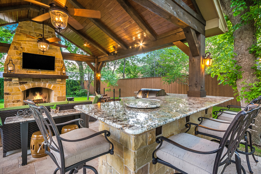 Example of a mid-sized mountain style backyard tile patio kitchen design in Houston with a gazebo