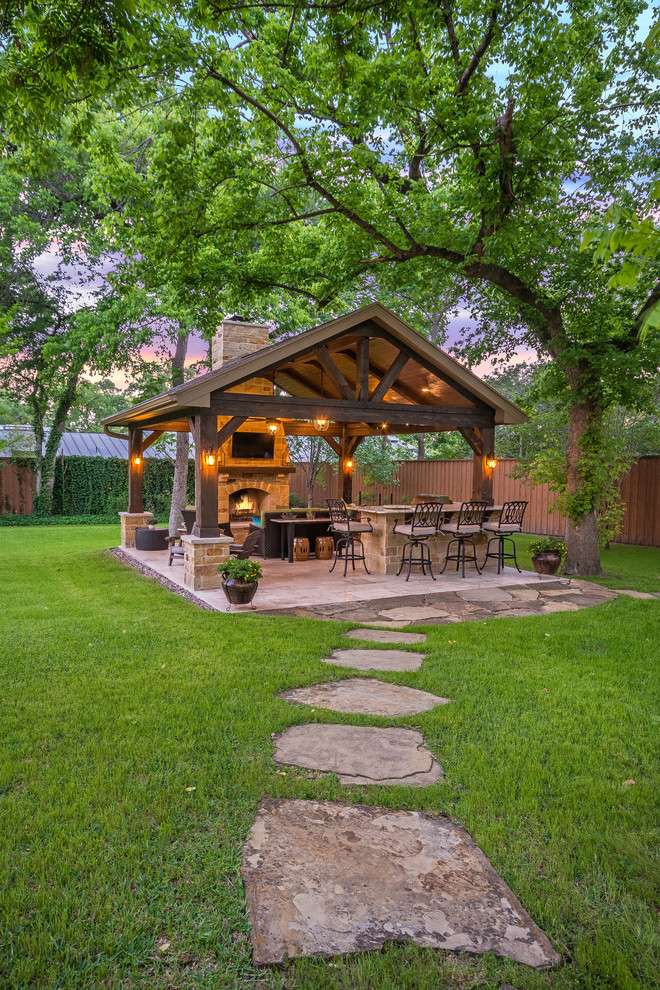 This is an example of a medium sized rustic back patio in Houston with tiled flooring, a gazebo and a bar area.