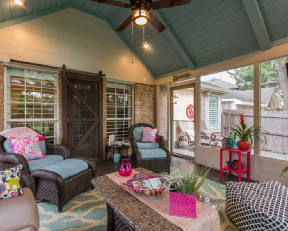 Mid-sized trendy backyard patio photo in Houston with a roof extension
