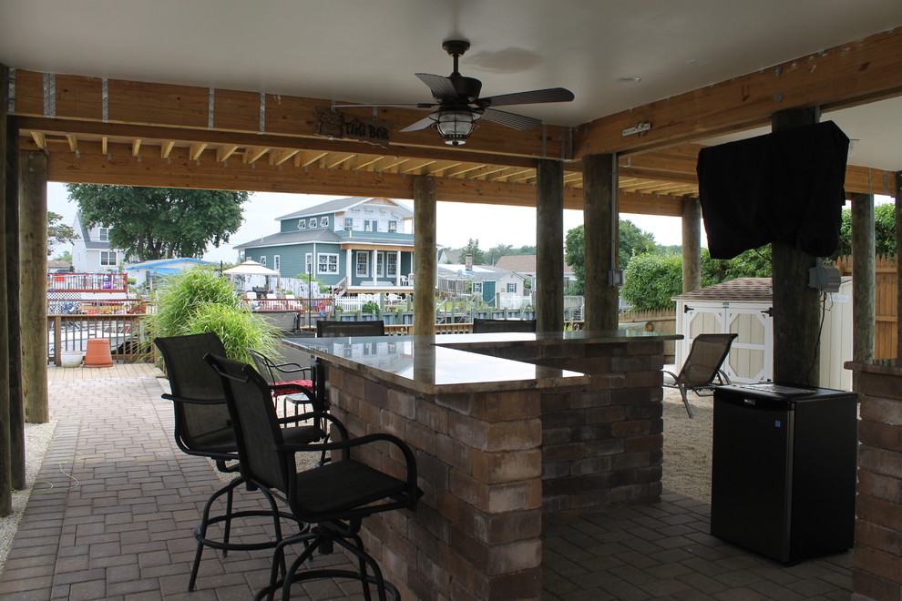 Photo of a medium sized coastal patio in New York with an outdoor kitchen.