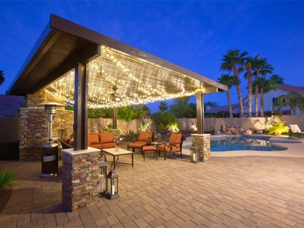 Photo of a large mediterranean back patio in Phoenix with a water feature, concrete paving and a gazebo.