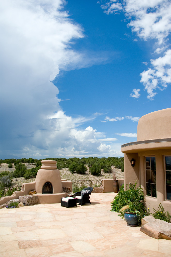 Patio - southwestern stone patio idea in Albuquerque with no cover