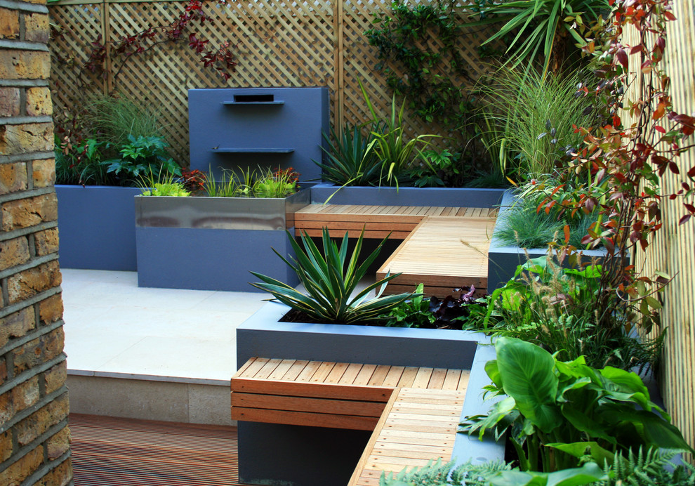 Photo of a small contemporary back patio in London.