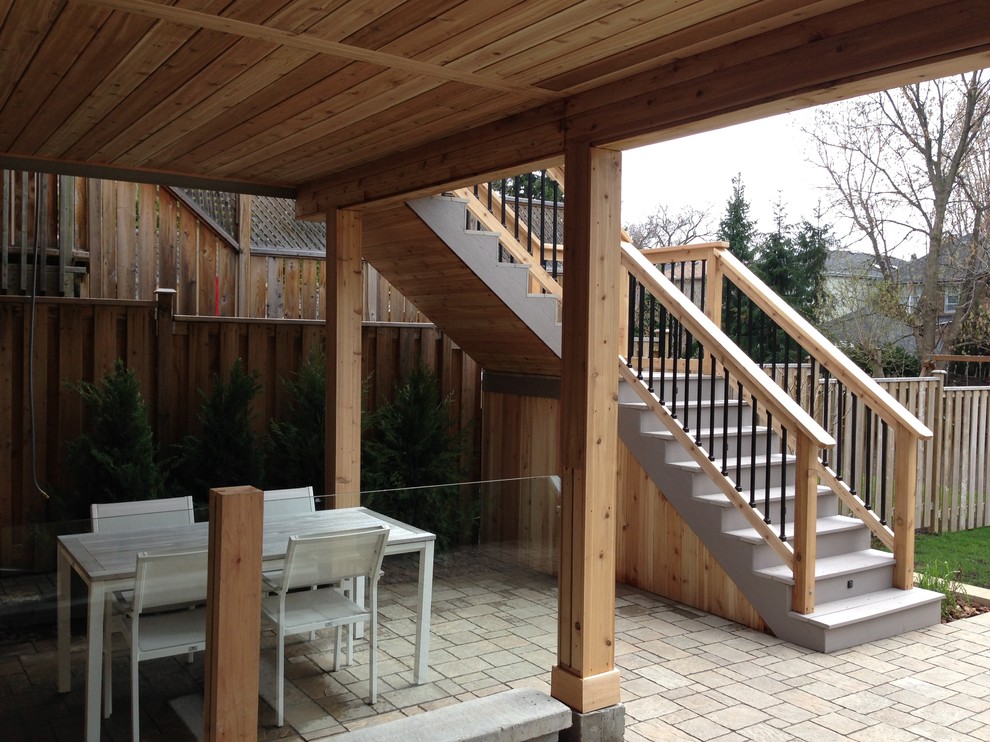 PVC deck with Tempered glass railings, Interlocking stone, and Basement