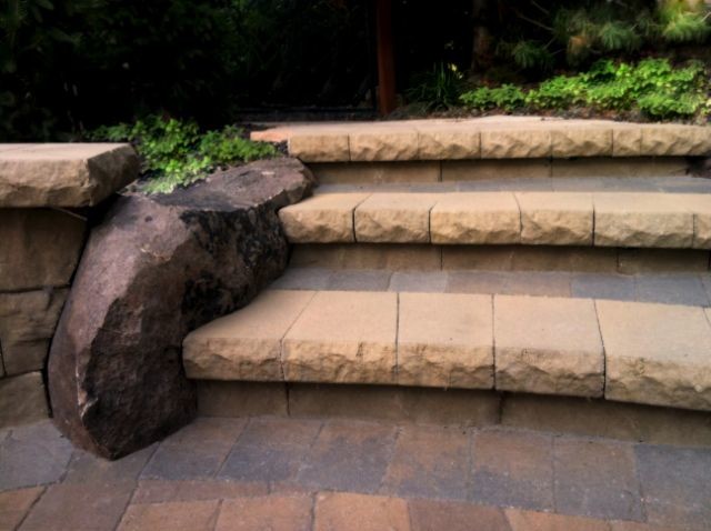 Inspiration for a mid-sized eclectic backyard concrete paver patio remodel in Boise with no cover