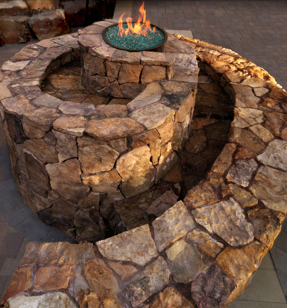 Patio - mid-sized eclectic backyard concrete paver patio idea in Boise with a fire pit and no cover