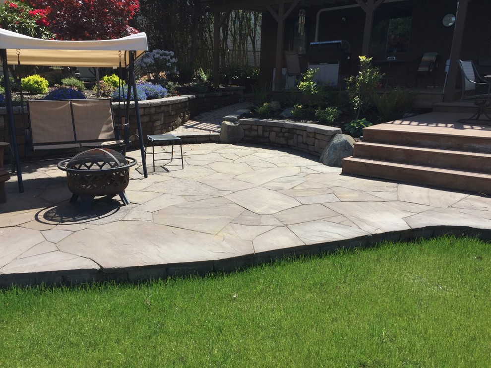 Raised Flagstone Patio Traditional Patio Seattle by DREAMSCAPES