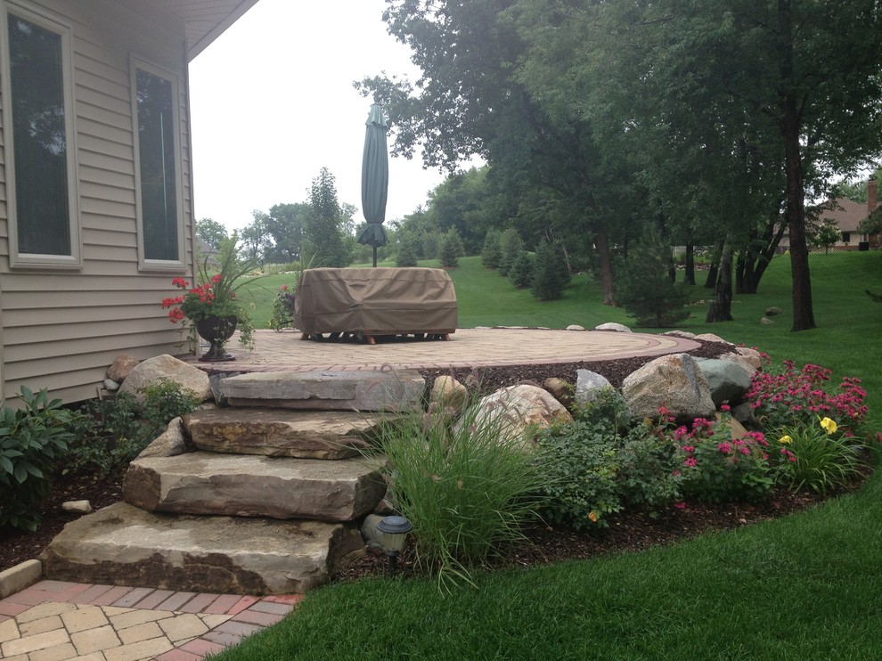 Raised Patio with Boulder Retaining Wall Transitional Patio