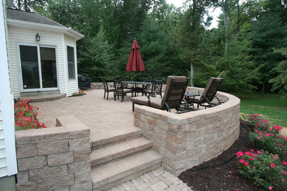 Photo of a medium sized contemporary back patio in Boston with concrete paving.