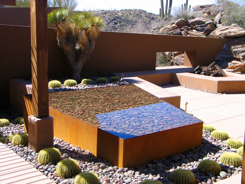 Southwest courtyard patio photo in Phoenix with a fire pit