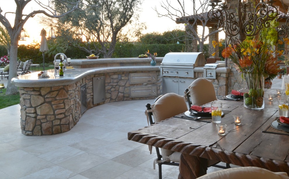 Design ideas for a large mediterranean back patio in San Diego with an outdoor kitchen and tiled flooring.