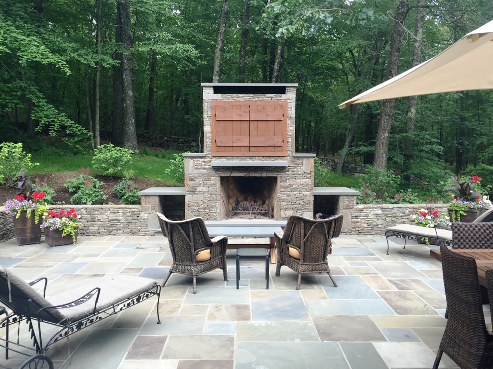 Inspiration for a medium sized traditional back patio in New York with an outdoor kitchen and tiled flooring.