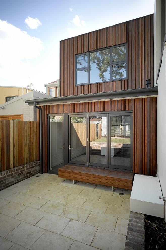 Foto de patio contemporáneo pequeño sin cubierta en patio trasero con adoquines de hormigón
