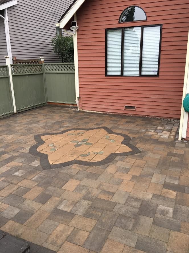 Inspiration for a small timeless backyard tile patio remodel in Seattle with no cover