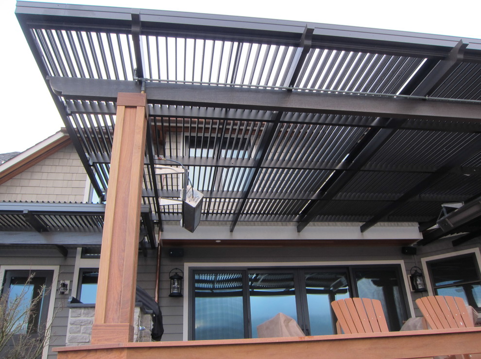 Inspiration for a mid-sized contemporary backyard patio remodel in Phoenix with decking and a roof extension