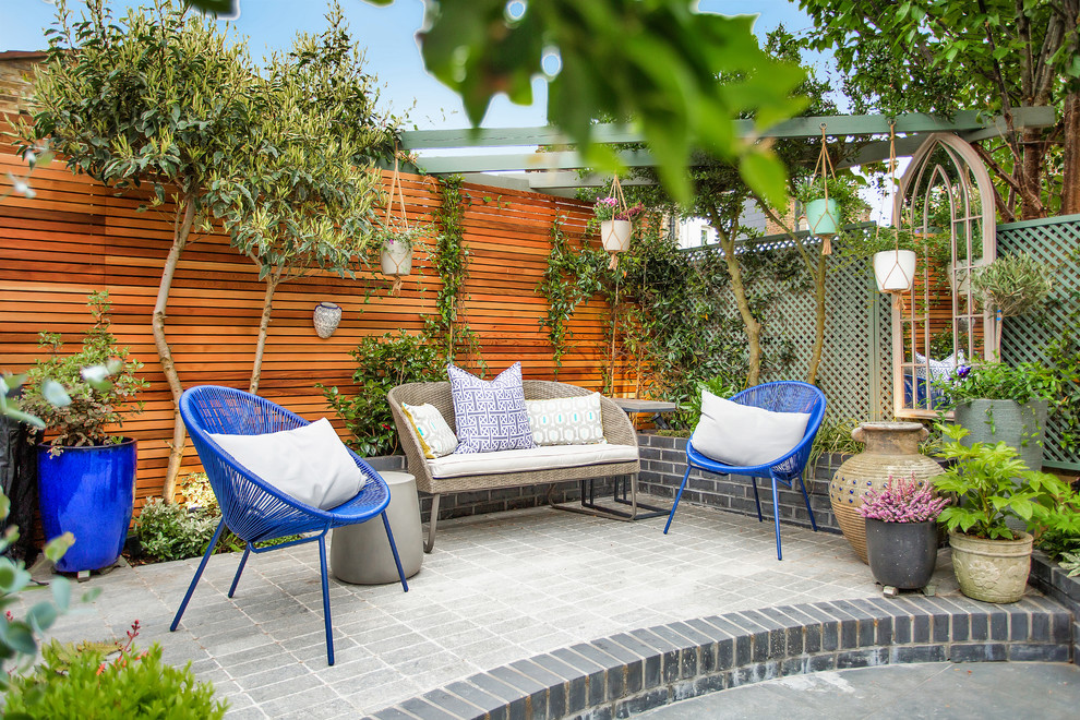 This is an example of a classic patio in London with a potted garden.