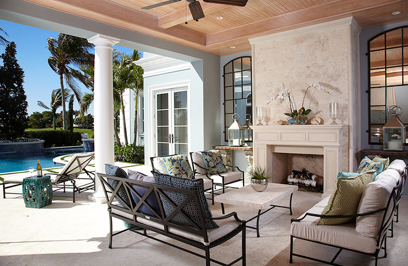 Inspiration for a large back patio in Miami with a fire feature, concrete slabs and no cover.