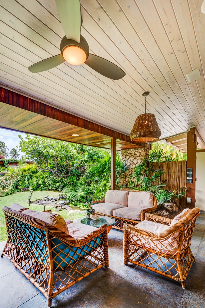 Inspiration for a tropical patio remodel in Hawaii with a roof extension