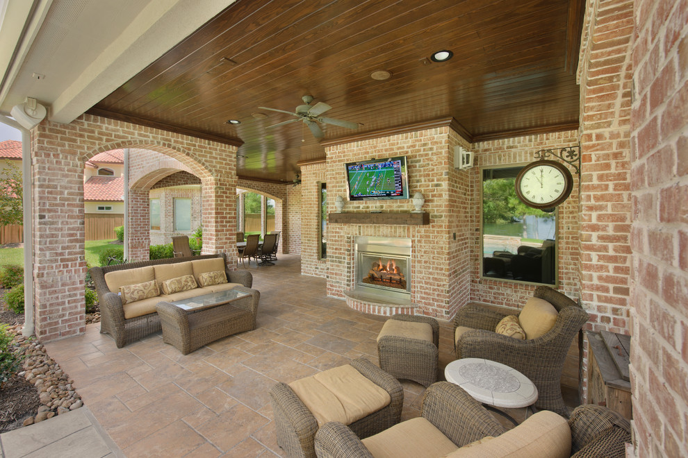 Traditional patio in Houston with a fire feature.
