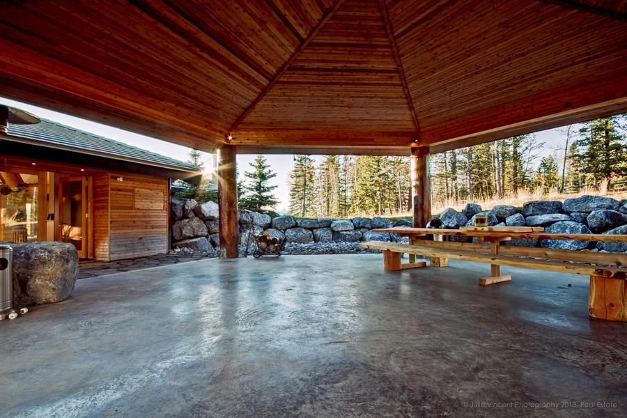 Example of a mountain style patio design in Calgary
