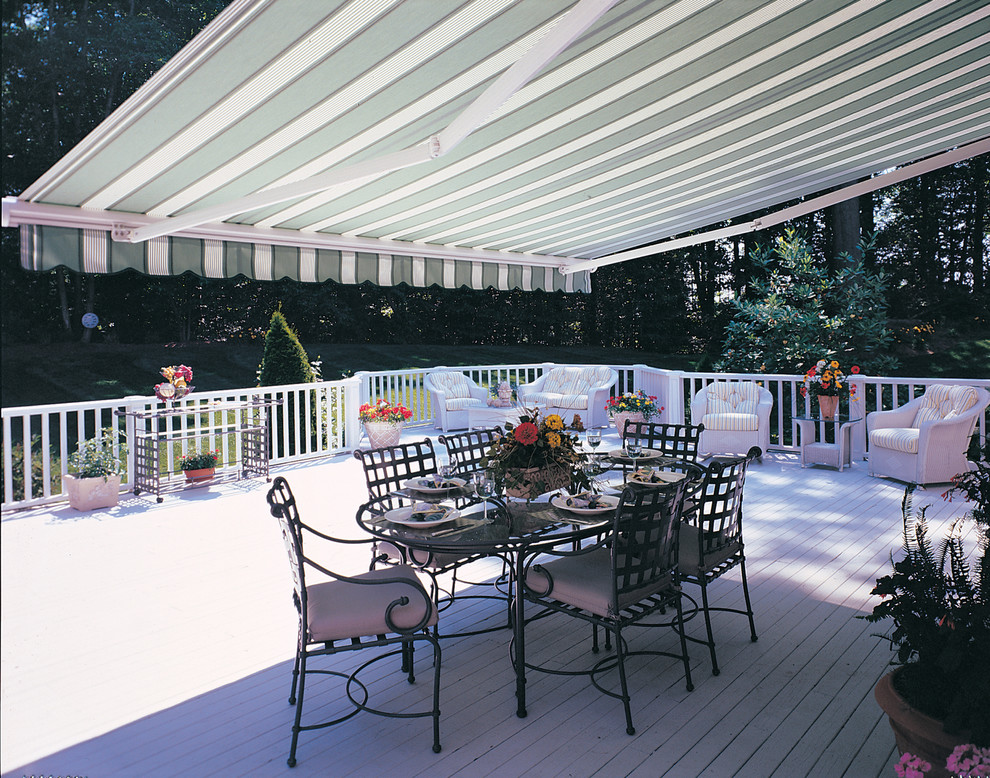 Patio - mid-sized backyard patio idea in Boston with decking and an awning