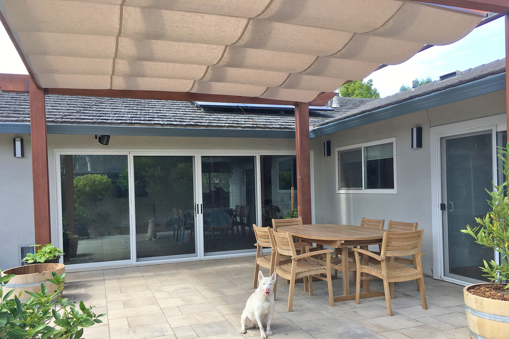 This is an example of a country patio in San Francisco with concrete paving.