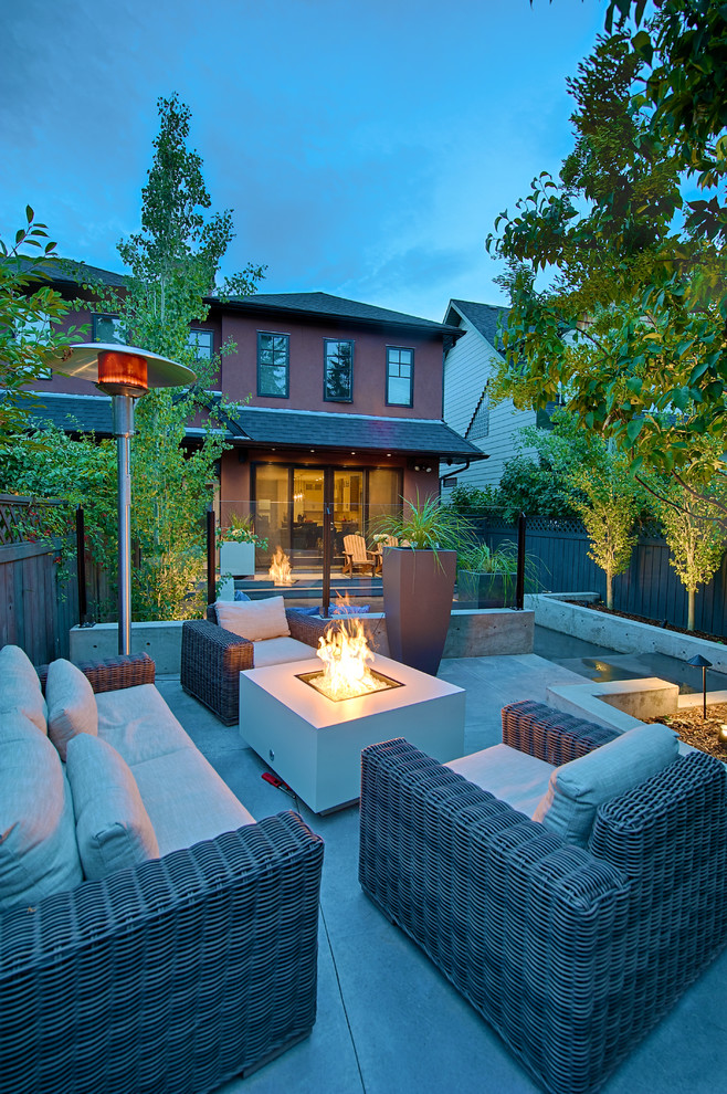 Patio - mid-sized contemporary backyard patio idea in Calgary with a fire pit and no cover