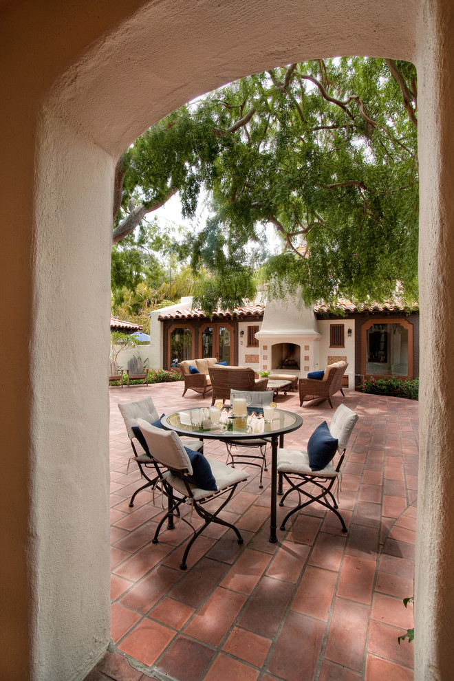 Example of a tuscan brick patio design in San Diego with no cover