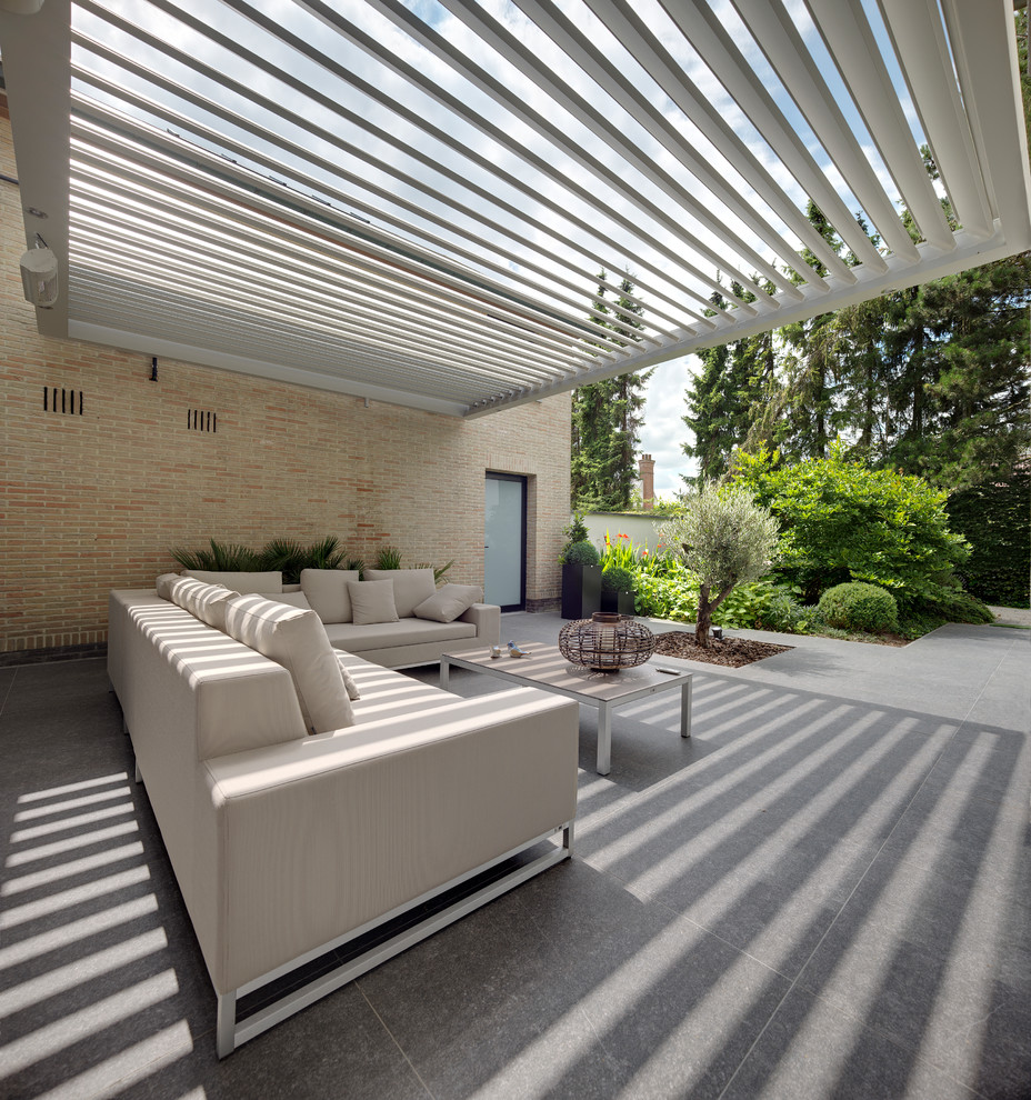 This is an example of a contemporary patio in Buckinghamshire.