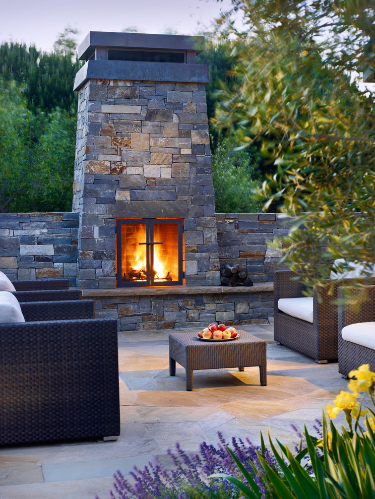 Example of a trendy patio design in San Francisco with no cover and a fireplace