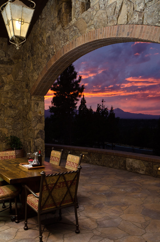 Example of a tuscan patio design in Other