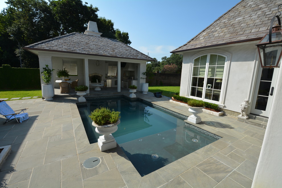 Inspiration for a mid-sized contemporary backyard tile patio remodel in New Orleans with a gazebo