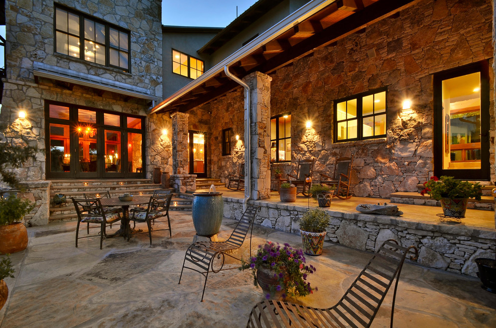 Example of a mountain style patio design in Austin with no cover