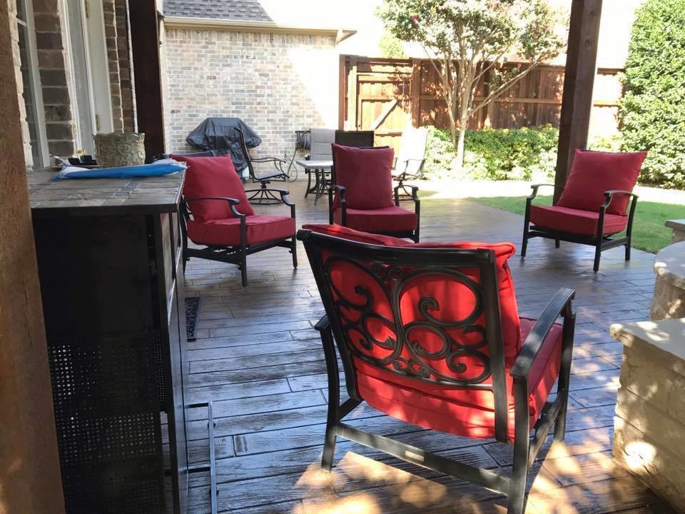 Rockwall Patio cover with corner fireplace and stamped concrete