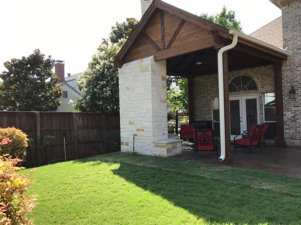 Rockwall Patio cover with corner fireplace and stamped concrete