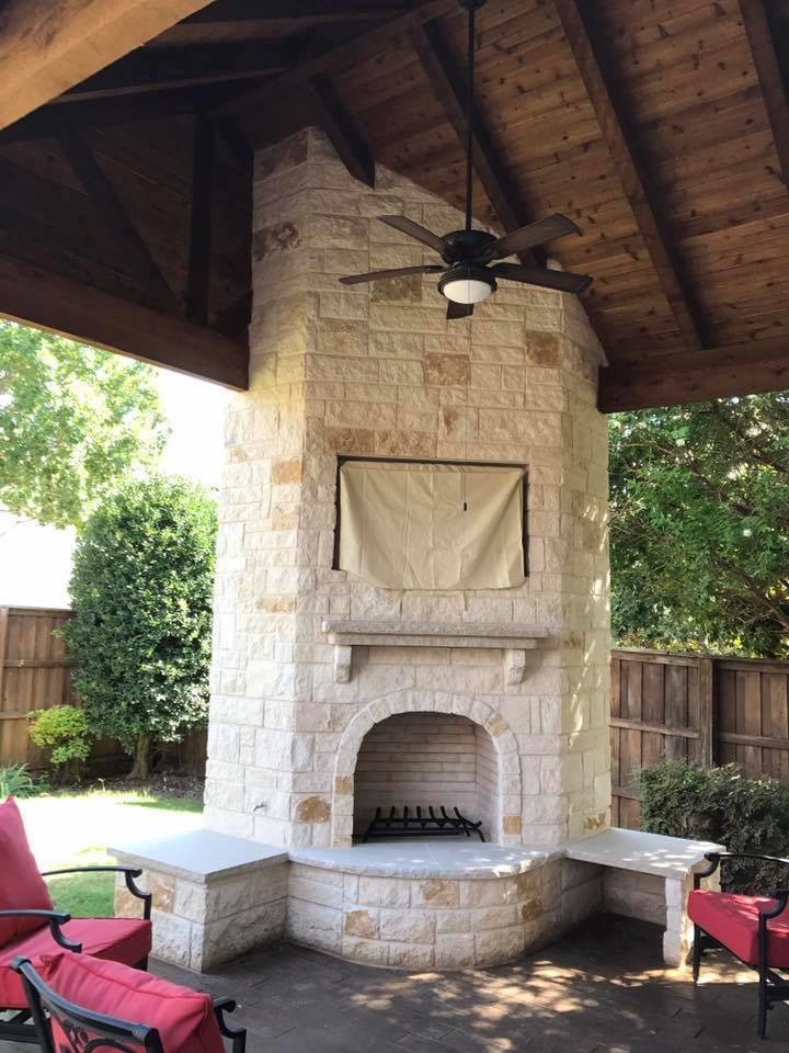 Rockwall Patio cover with corner fireplace and stamped concrete