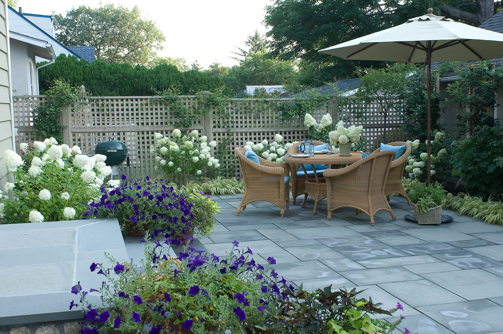 Elegant patio photo in New York with no cover