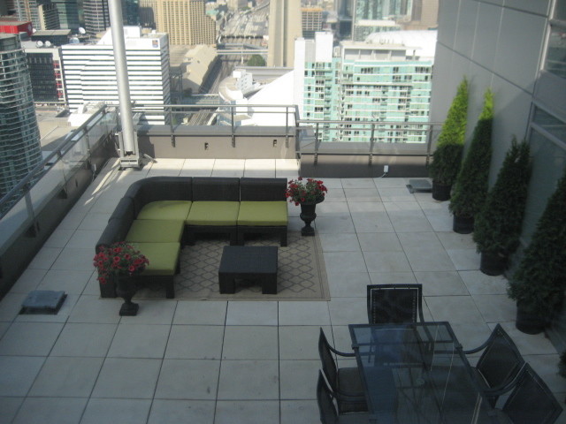 Patio - huge contemporary concrete paver patio idea in Toronto with no cover
