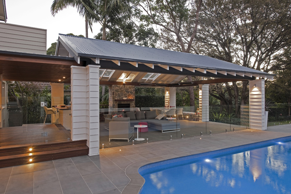 Patio - large contemporary backyard patio idea in Sydney with a fire pit and a gazebo