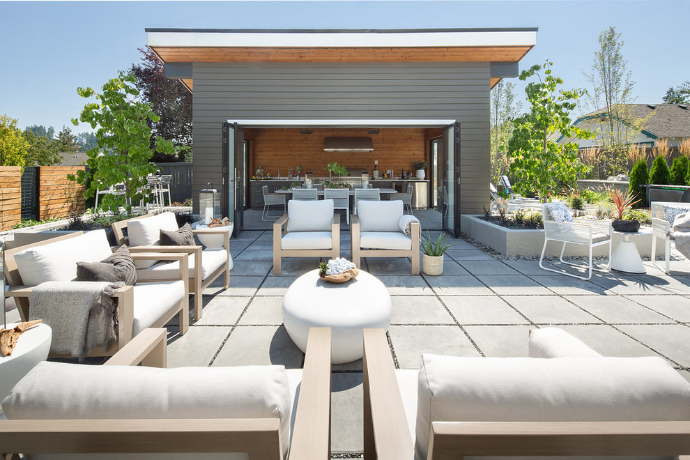 Inspiration for a contemporary back patio in Seattle with concrete paving and no cover.