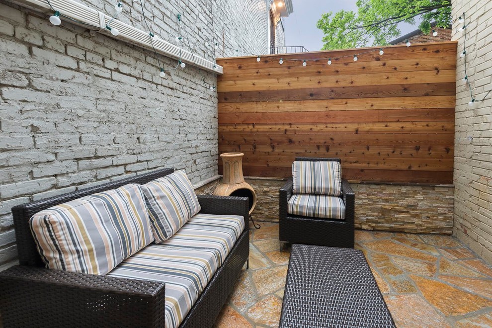 Small trendy backyard stone patio photo in DC Metro with no cover