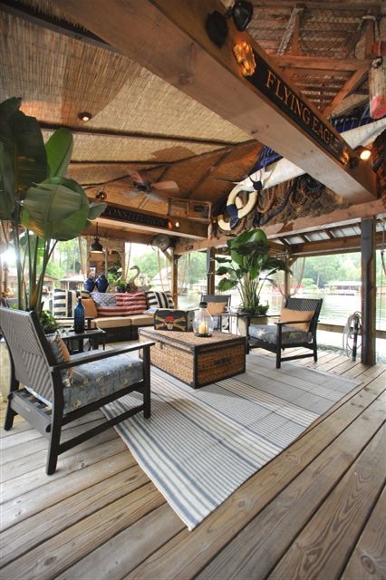 Inspiration for a large tropical backyard patio remodel in Atlanta with decking and a roof extension