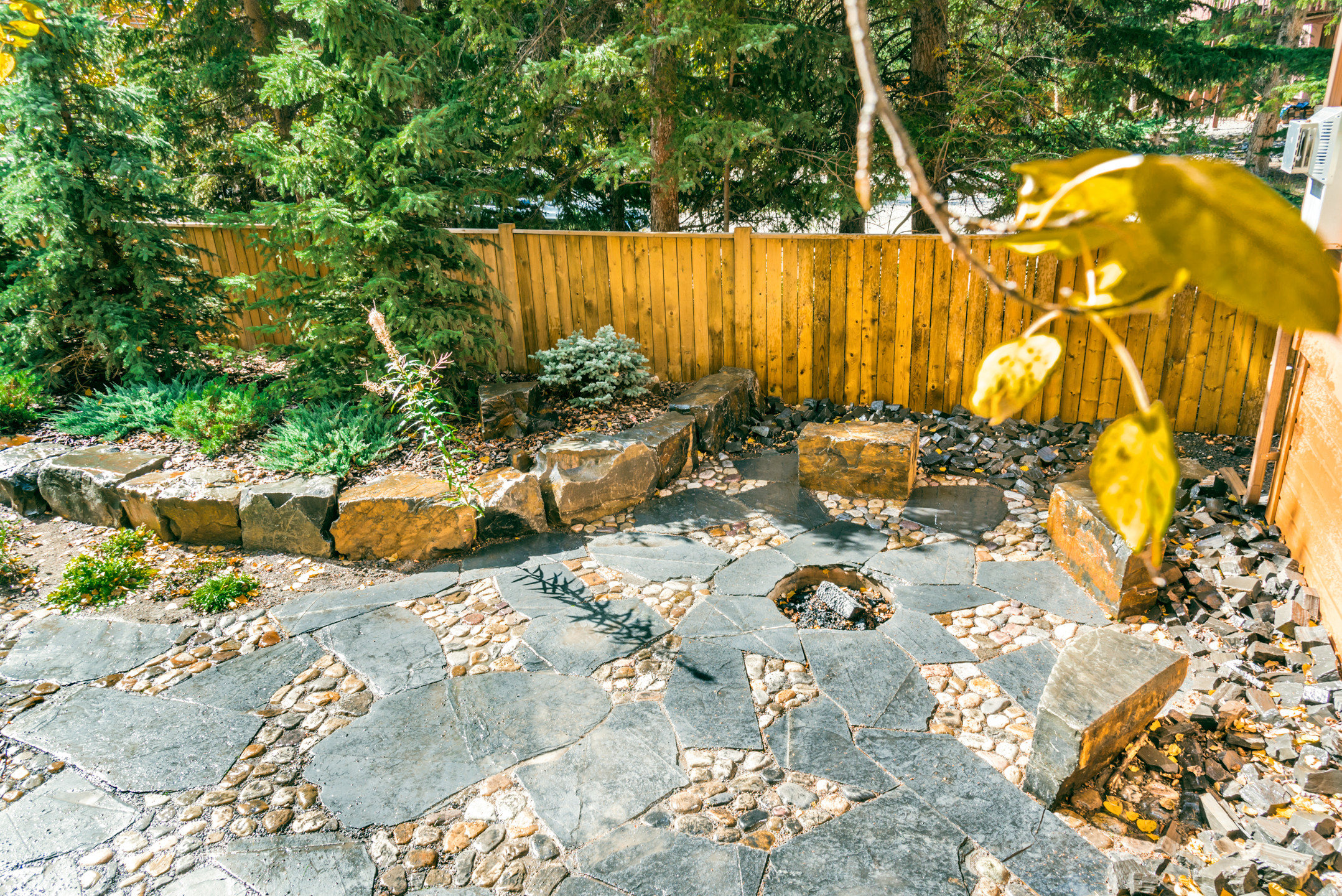 Rundle Stone And River Rock Patio With, River Rock Fire Pit