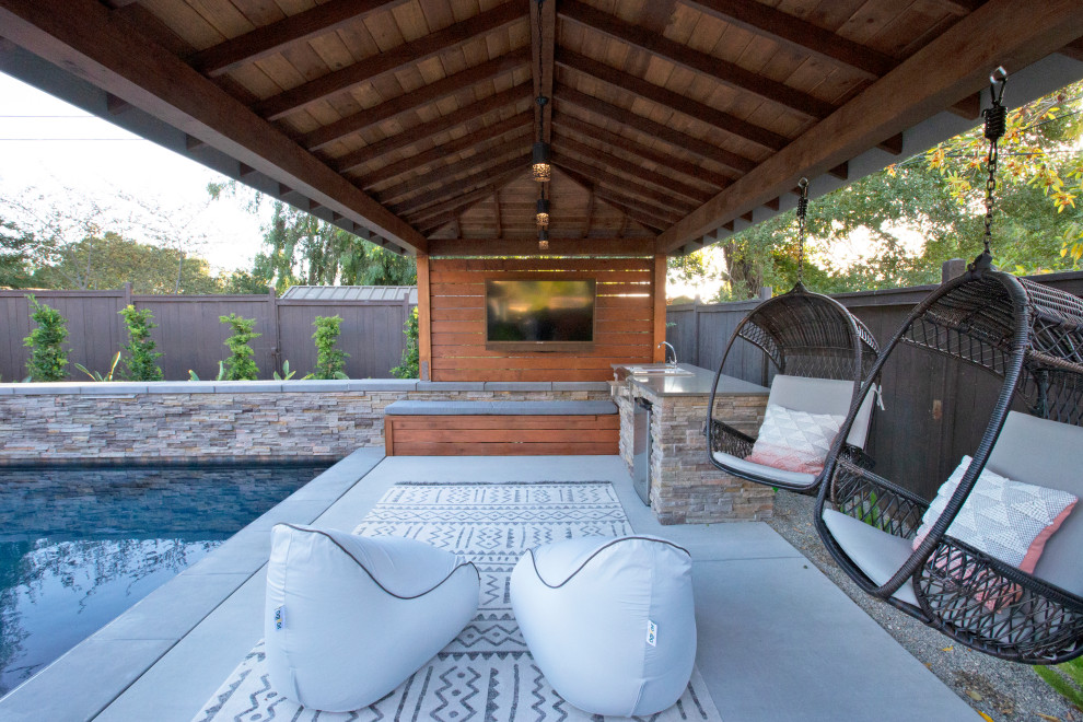 Example of a large minimalist backyard concrete patio design in San Luis Obispo with a gazebo