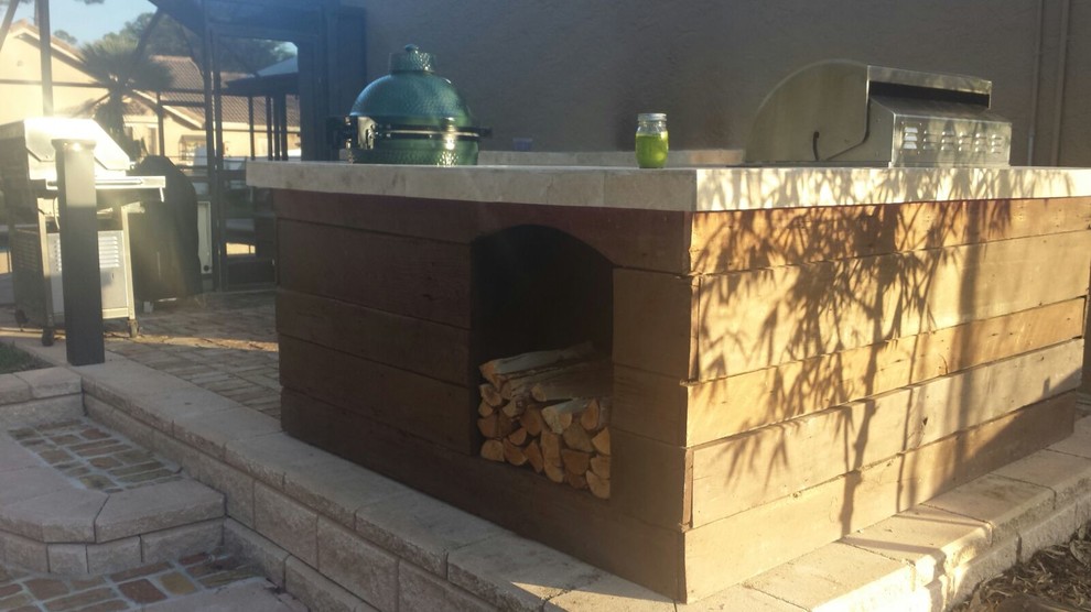 Rustic Reclaimed Wood Outdoor Kitchen with Green Egg & Firewood Box