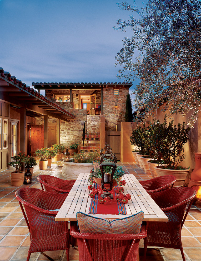 Mediterranean patio in San Diego with tiled flooring and no cover.