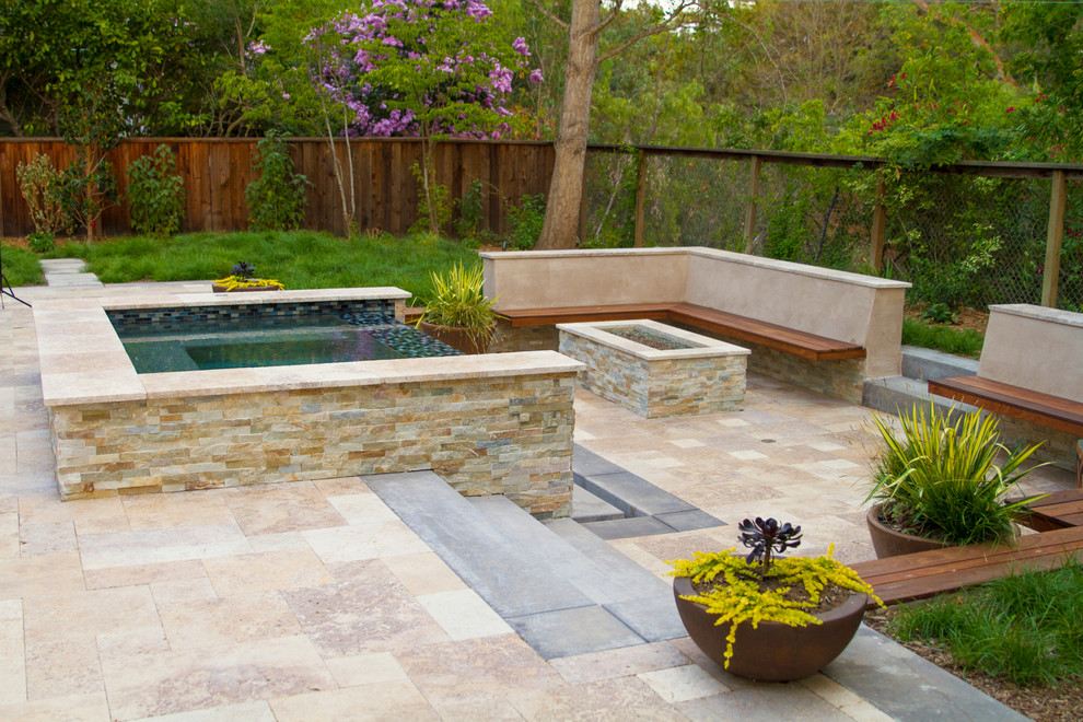 Example of a large trendy backyard stone patio design in San Francisco with a fire pit