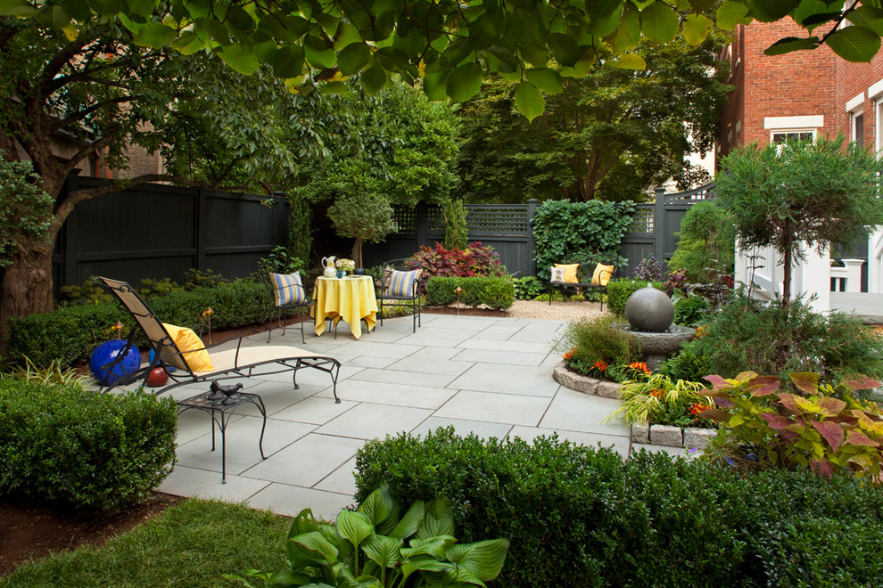 Mid-sized elegant backyard concrete paver patio photo in Boston