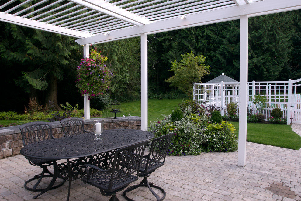 Design ideas for a classic patio in Seattle with a pergola.